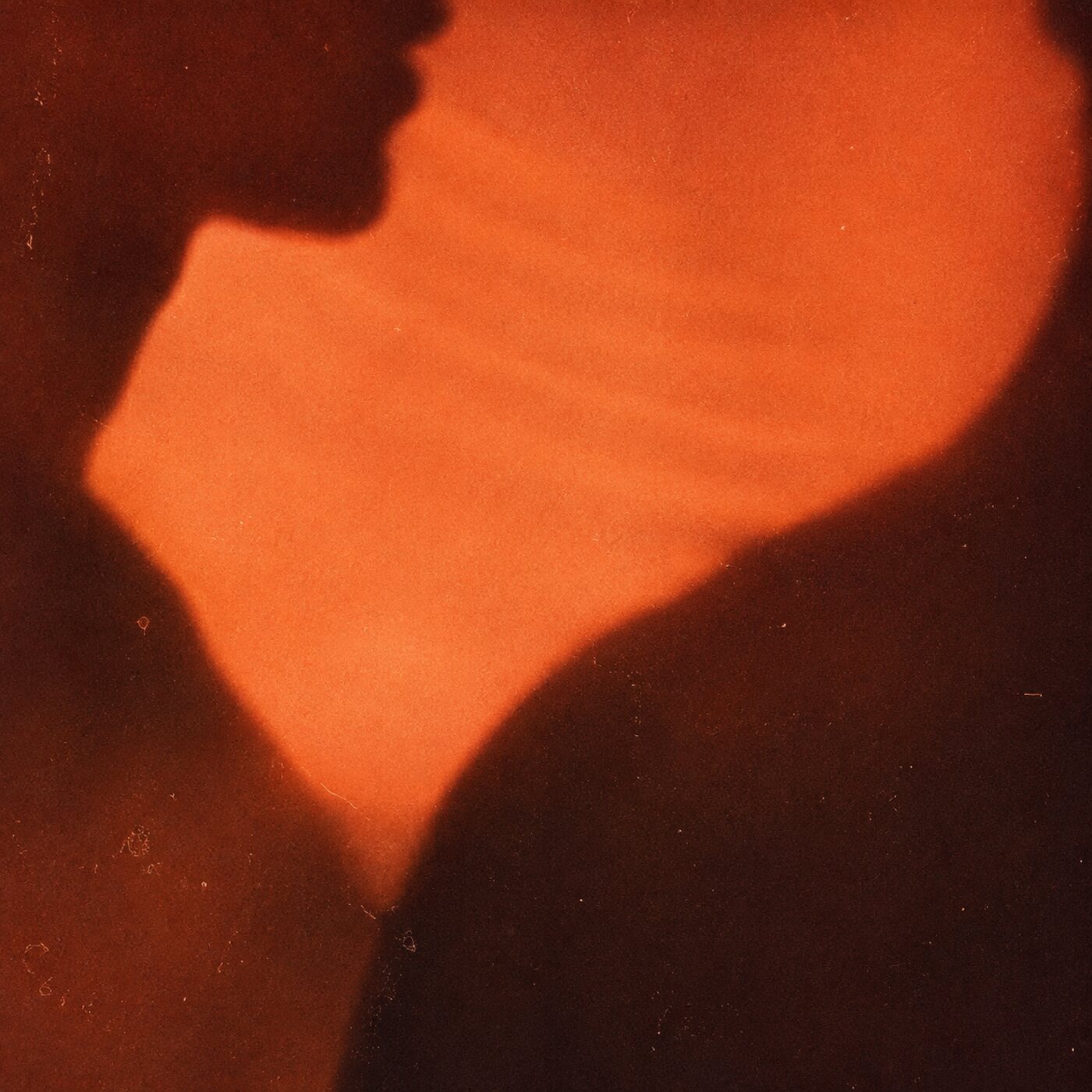 A silhouette with sound moving across the throat